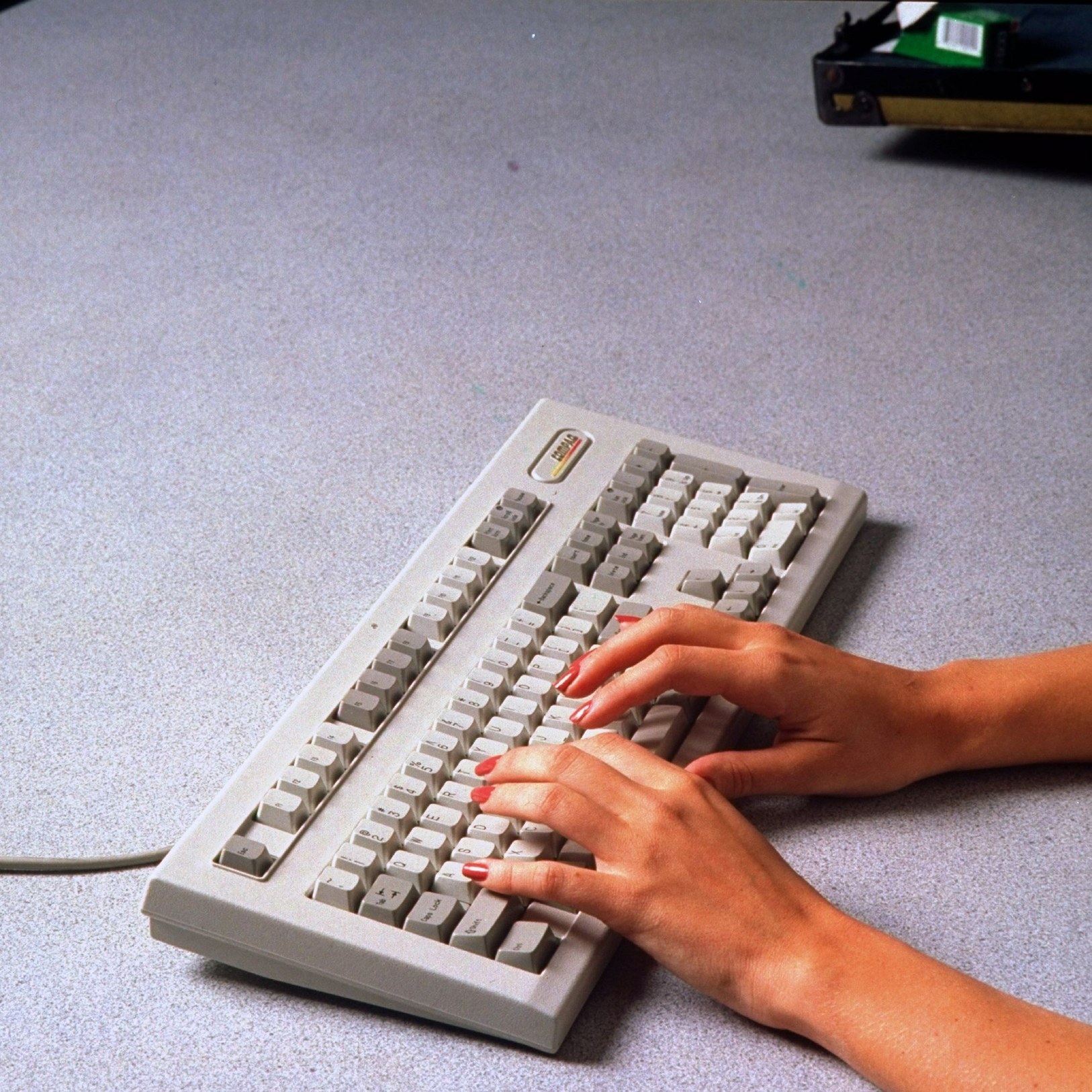 Hands typing on a keyboard